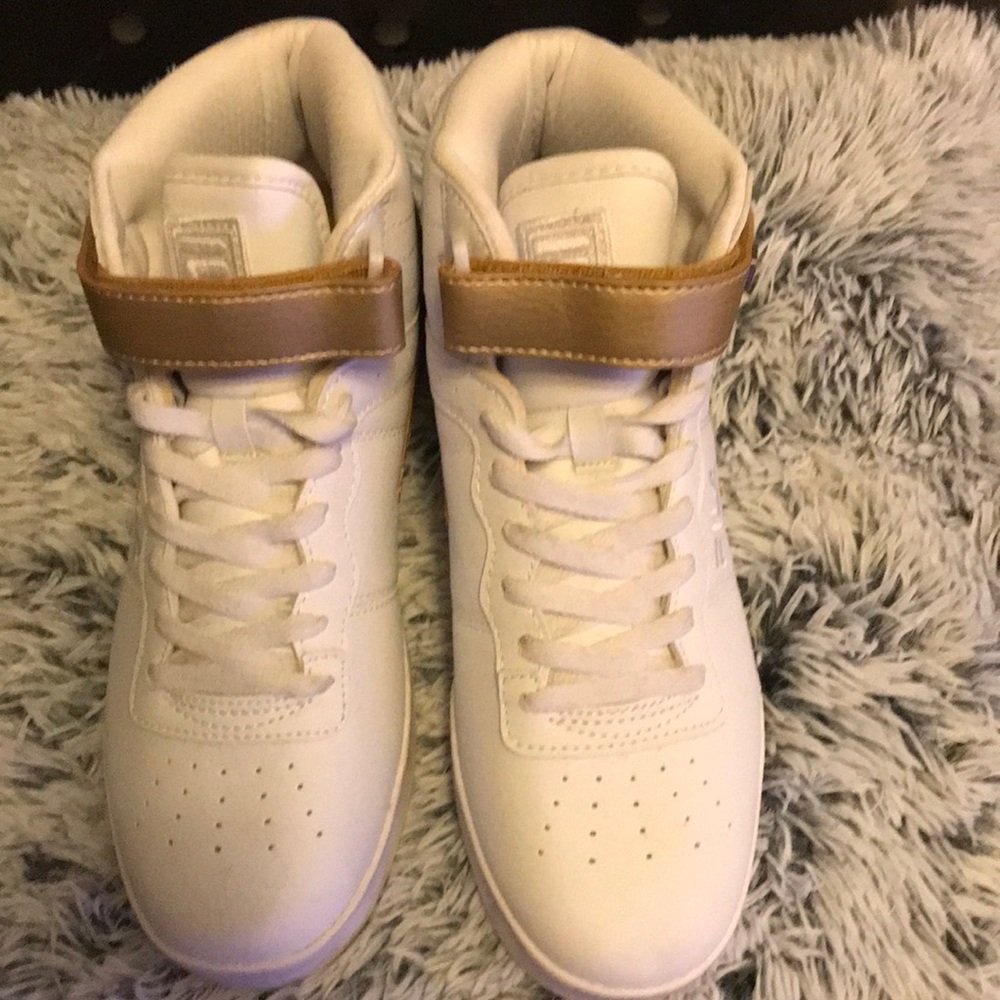 Women’s high top Fila sneakers.